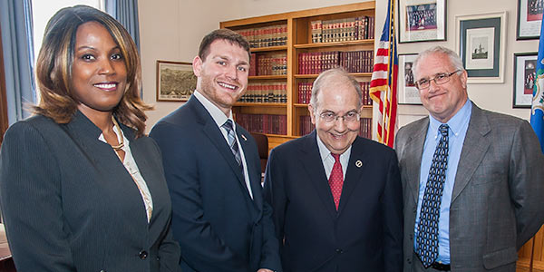 Photo of Senator Looney with veterans who are small business owners.